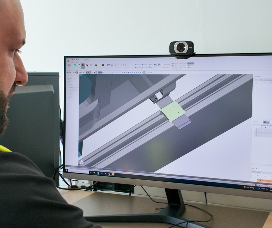 Custom manufacturing with close up on screen of metalwork design